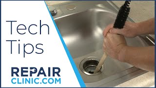 Use A Wood Handle to Unjam Garbage Disposal  Tech Tips from Repair Clinic [upl. by Uchish428]